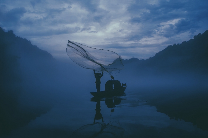 Fisherman. Photo by Yue Su on Unsplash